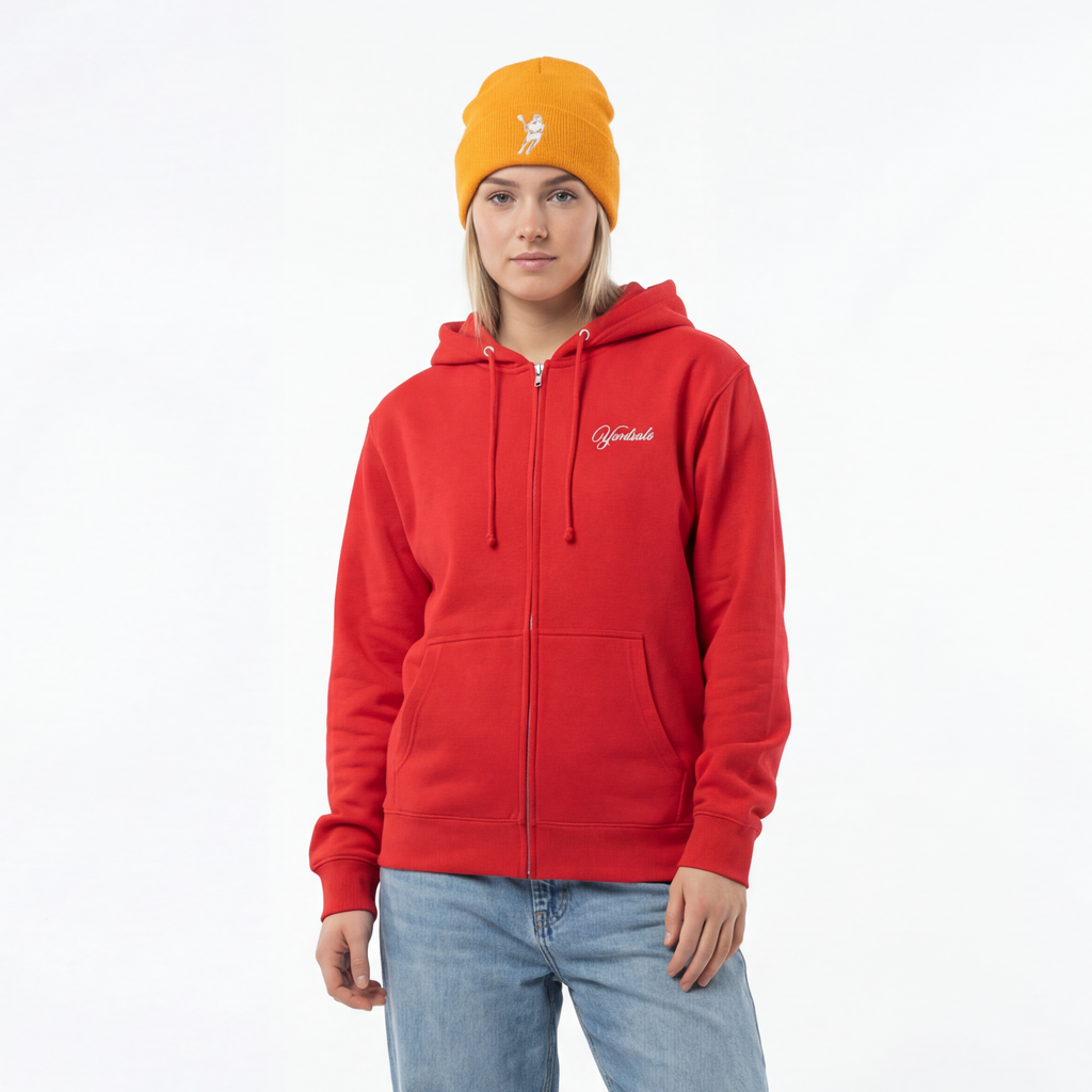Person wearing a red hoodie with a logo, light blue jeans, and a yellow beanie on a white background