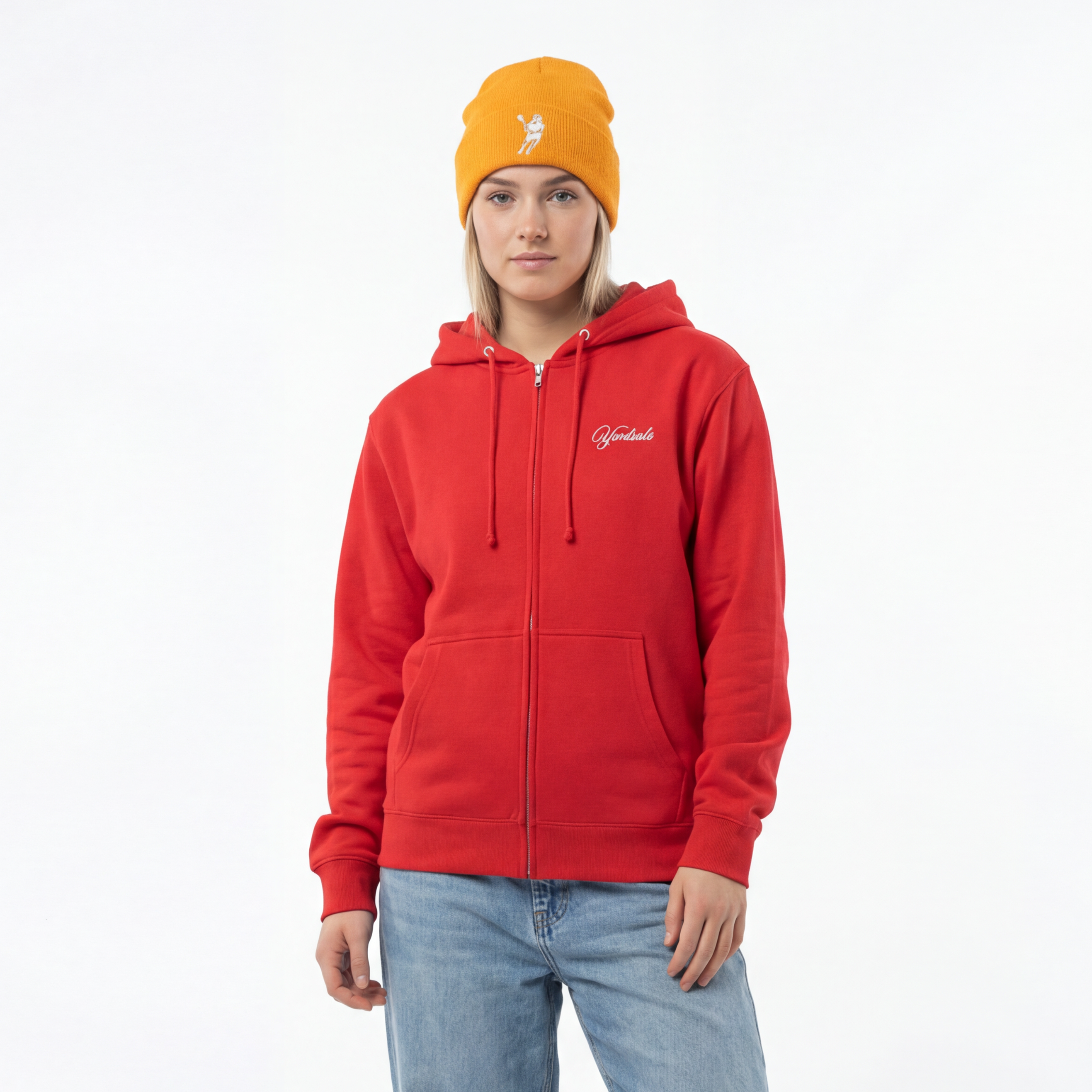 Person wearing a red hoodie with a logo, light blue jeans, and a yellow beanie on a white background