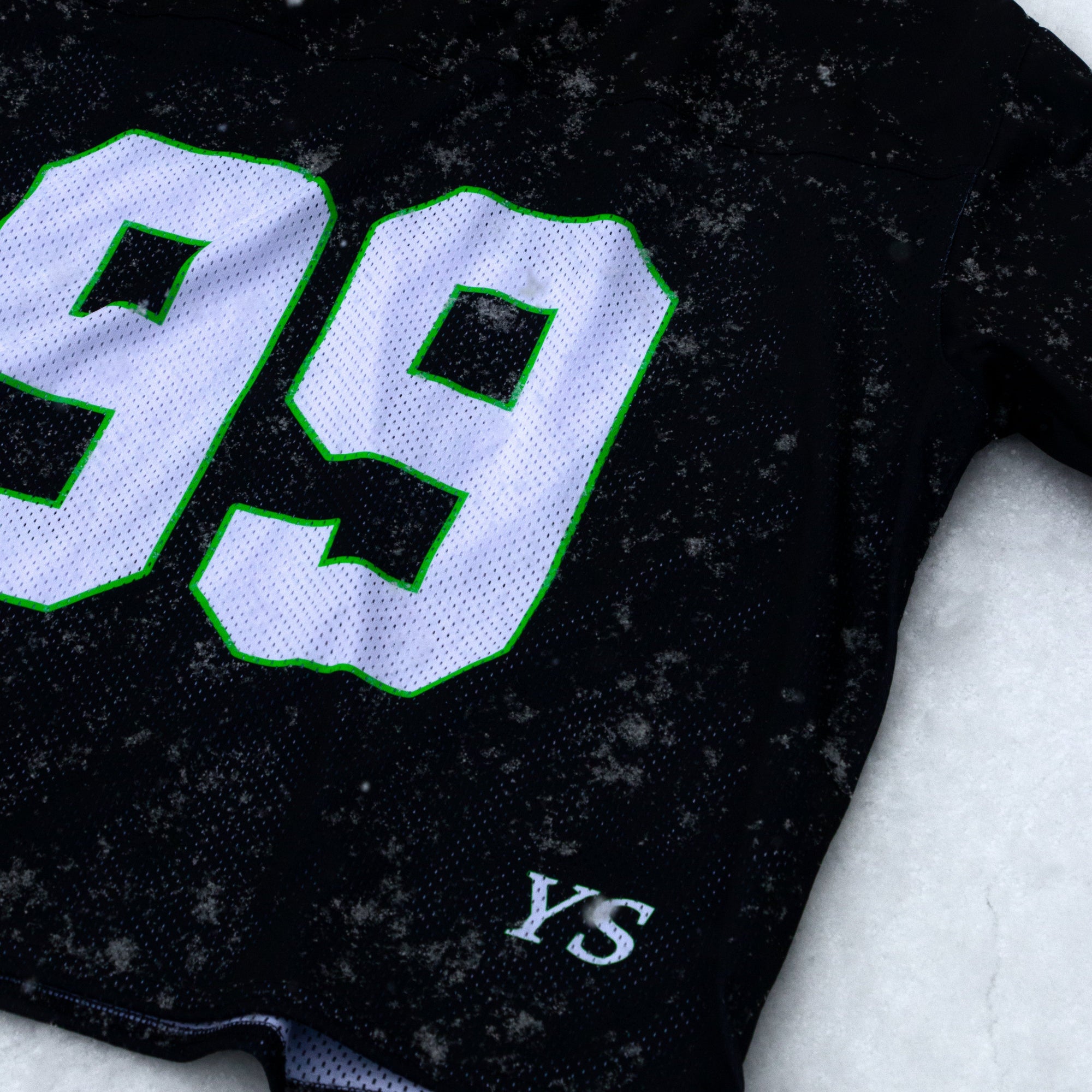 Black sweatshirt with '99' and 'YS' text on a hanger against a light background